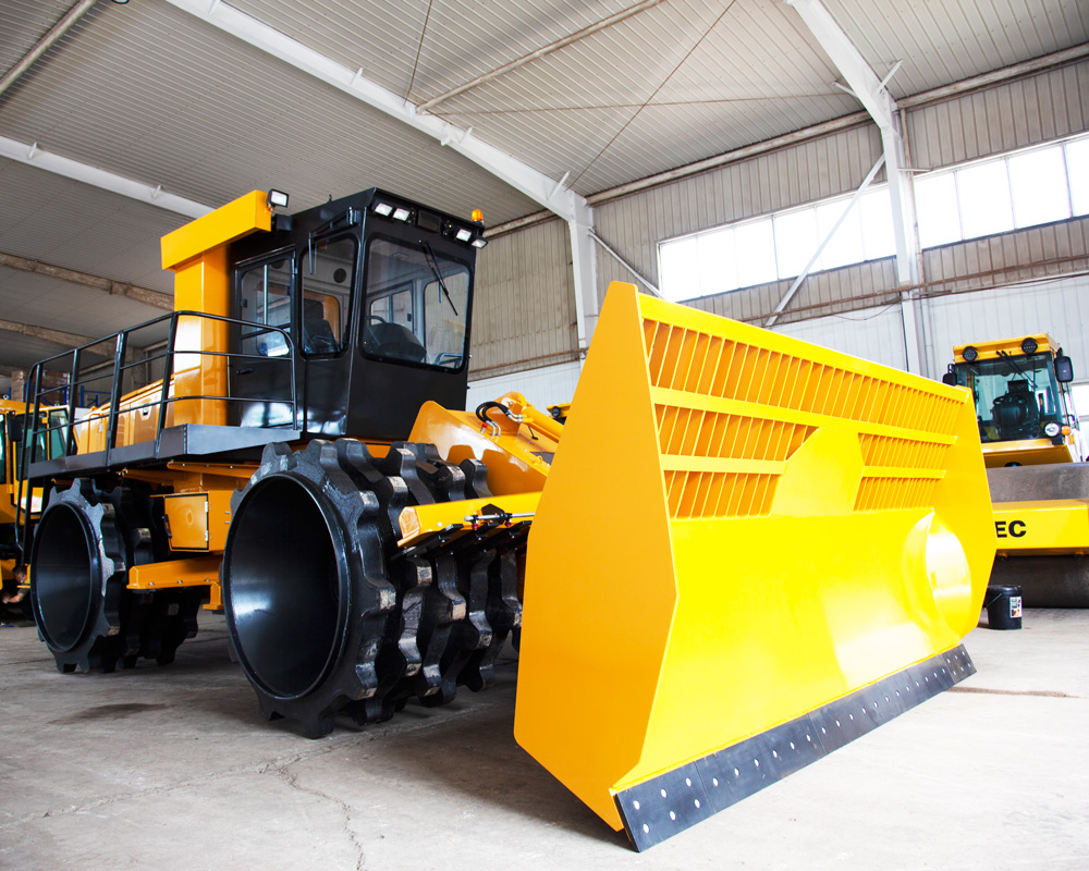Side view of the waste compactor